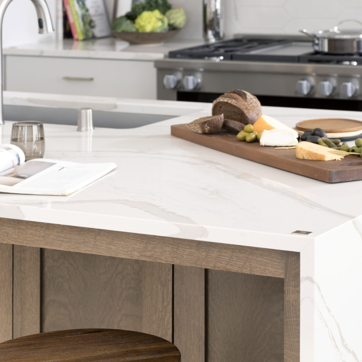 Brittanicca Warm Cambria Quartz Kitchen Countertops and Island with Waterfall Panel Edge Close Up