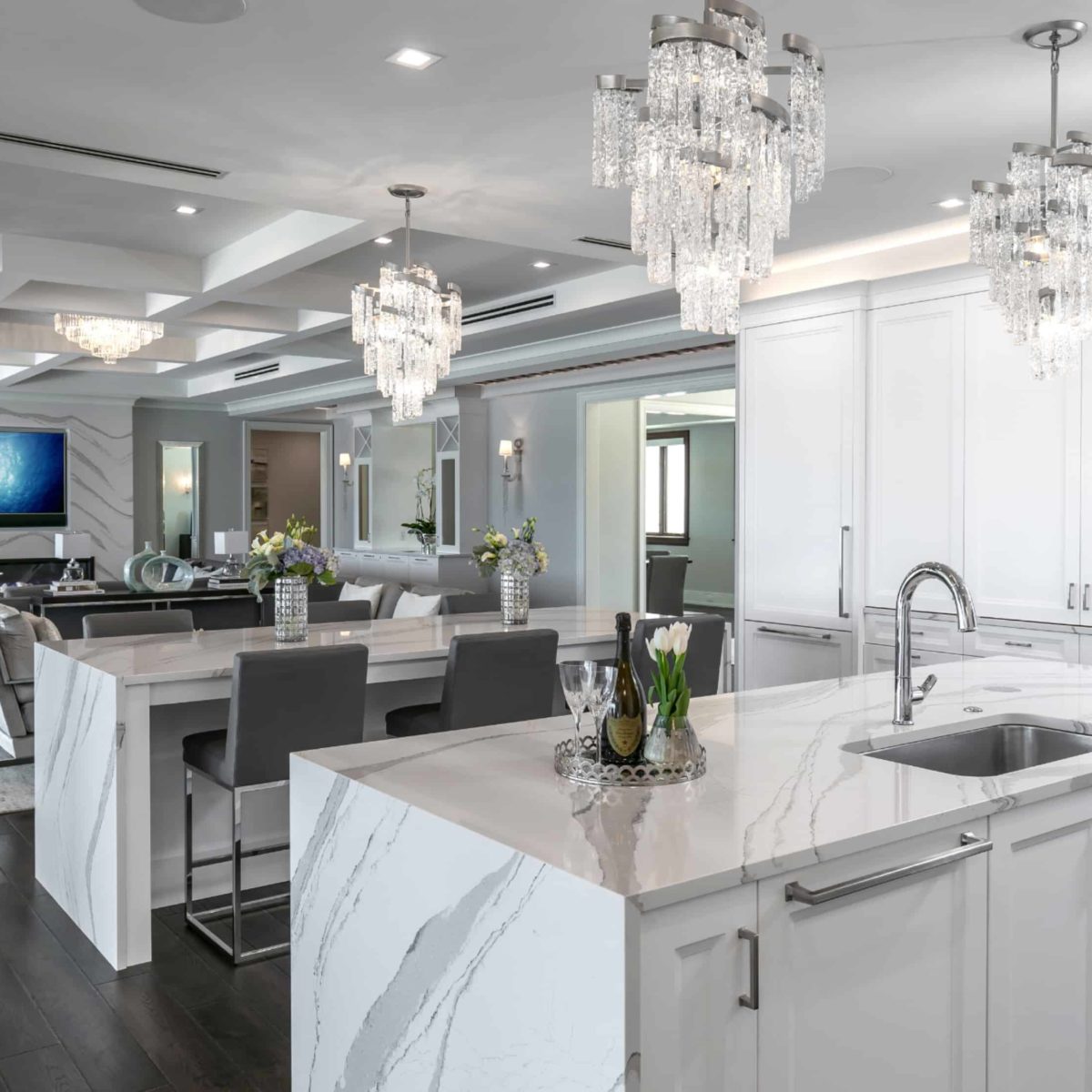 Cambria Brittanica Kitchen Countertops Bathroom Countertops White and Gray Quartz Countertops White Cabinets Kitchen Island marble looking quartz International Granite and Stone Trinity Construction and Design Collaboration gray furniture gray flooring white tile white backsplash