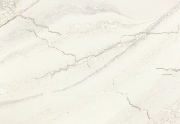 Close-up view of Cambria Inverness Everleigh Quartz surface, showcasing its intricate blend of cool gray and warm, sand-honey tones with debossed Inverness veins.