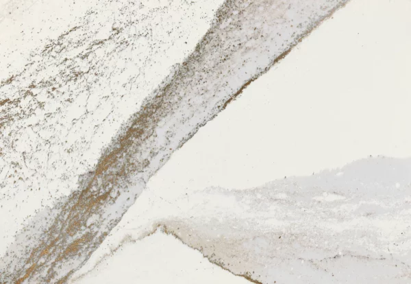 Close-up view of rich brown currents flowing against a crisp white background, accented by subtle flashes of radiant brass in Cambria Windsor Brass Quartz design